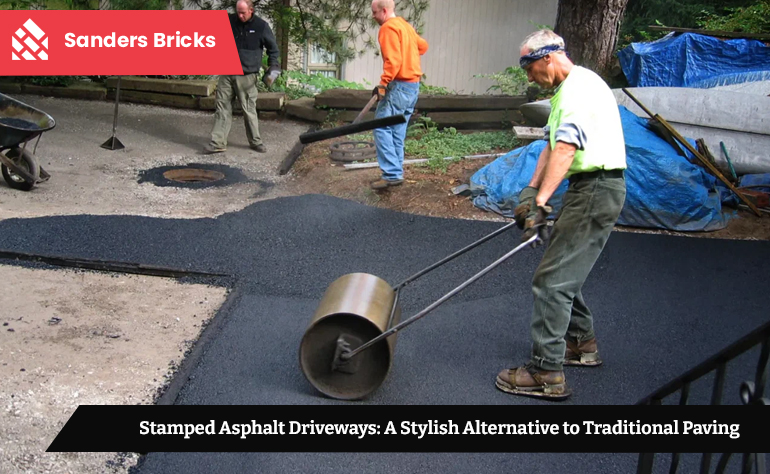 Workers installing a stamped asphalt driveway with a patterned roller